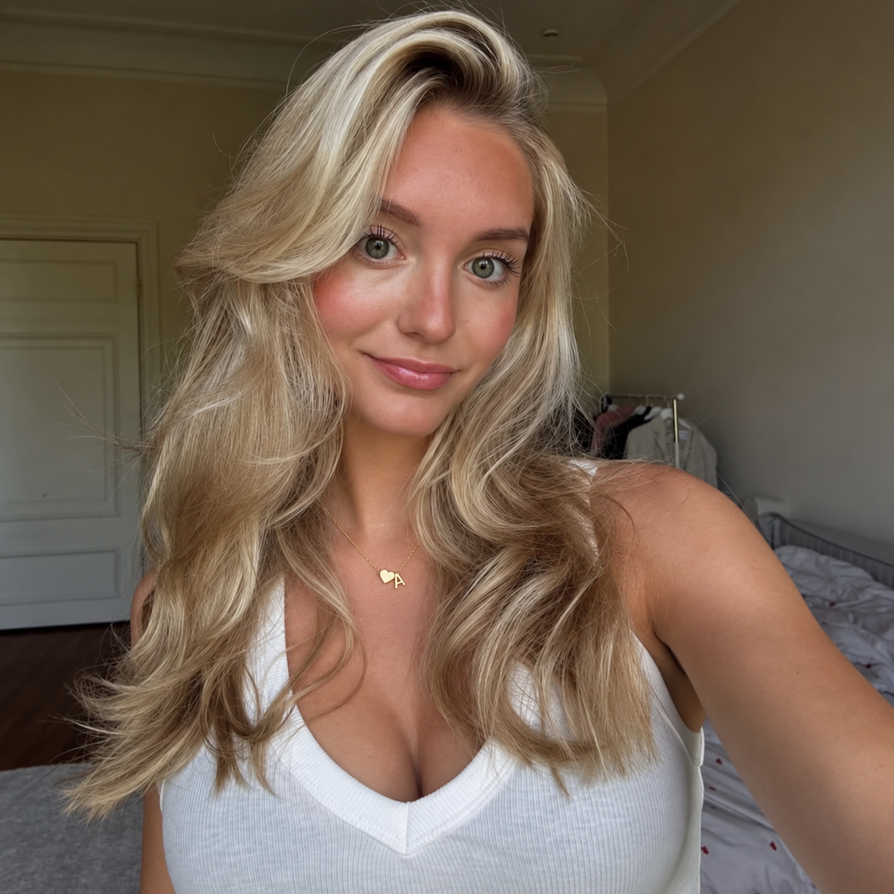 Heart and initial necklace with a white V-neck top