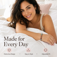 Latina woman styling the Aura bracelet in a bright morning bedroom