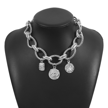 All-silver-tone twisted-link necklace with three coin-style charms