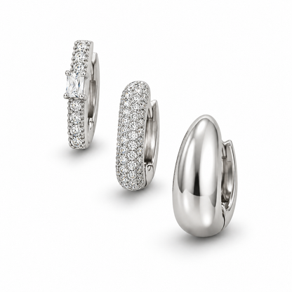 Silver Tone three-piece chunky hoop earring set on white