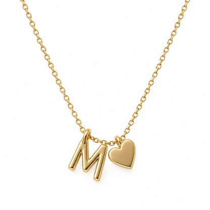 M-initial and heart necklace shown on a white background