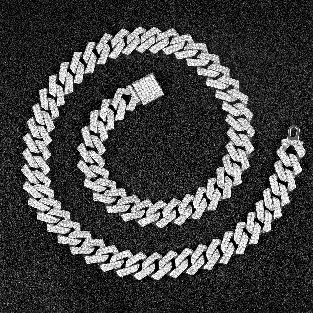 Silver-tone Cuban link chain on black background