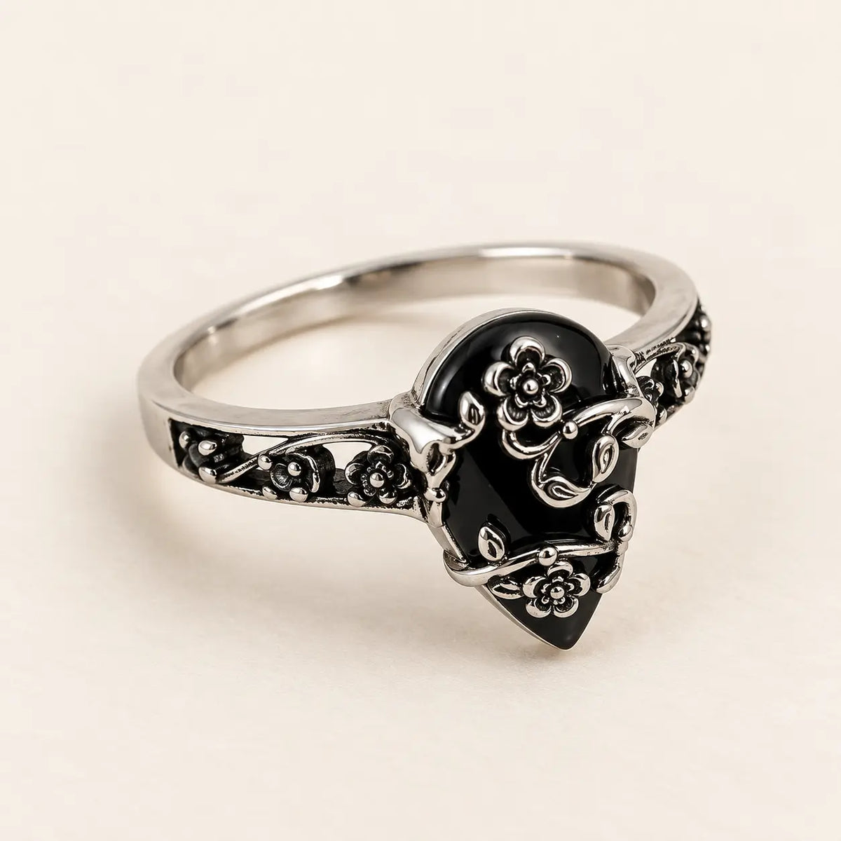 Exact angled product view of the black teardrop flower ring