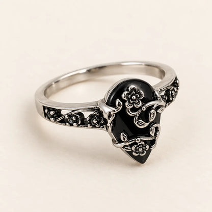 Exact angled product view of the black teardrop flower ring