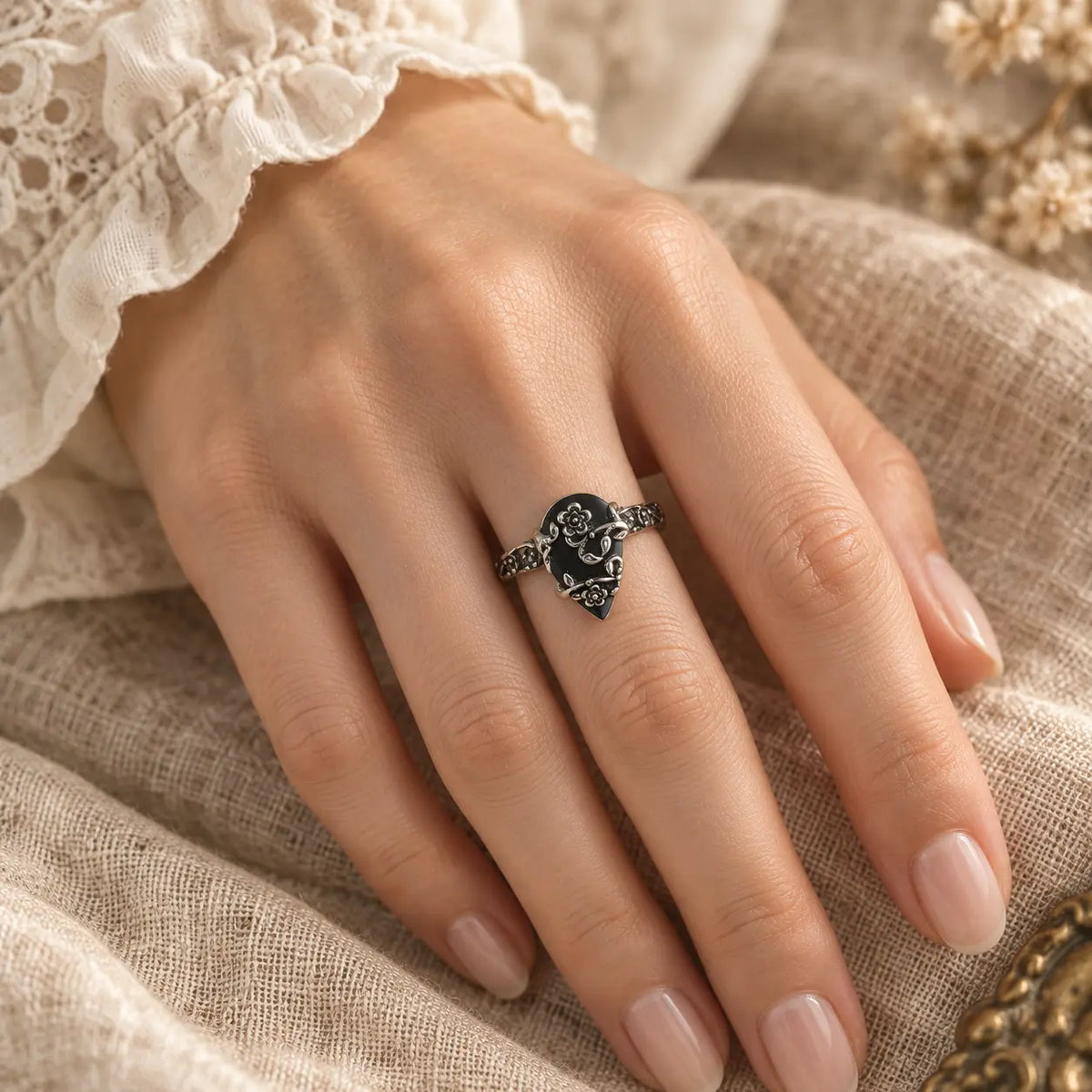Exact on-hand view of the Vintage Black Stone Flower Ring
