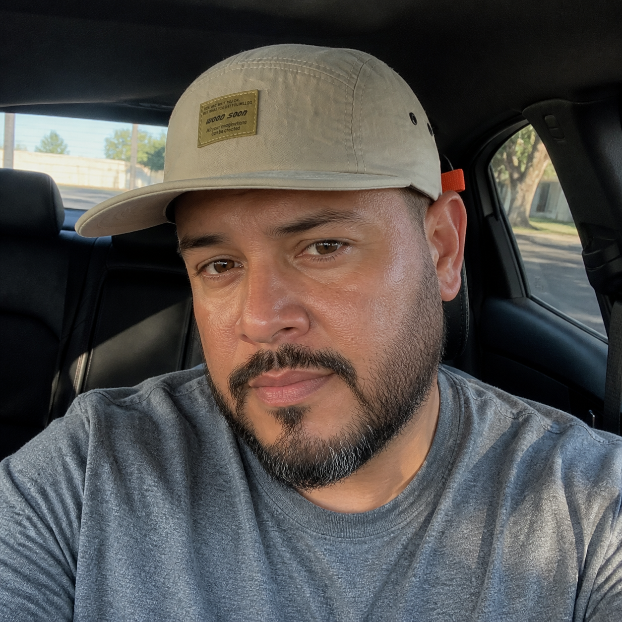 Man wearing the lightweight cap in a parked car