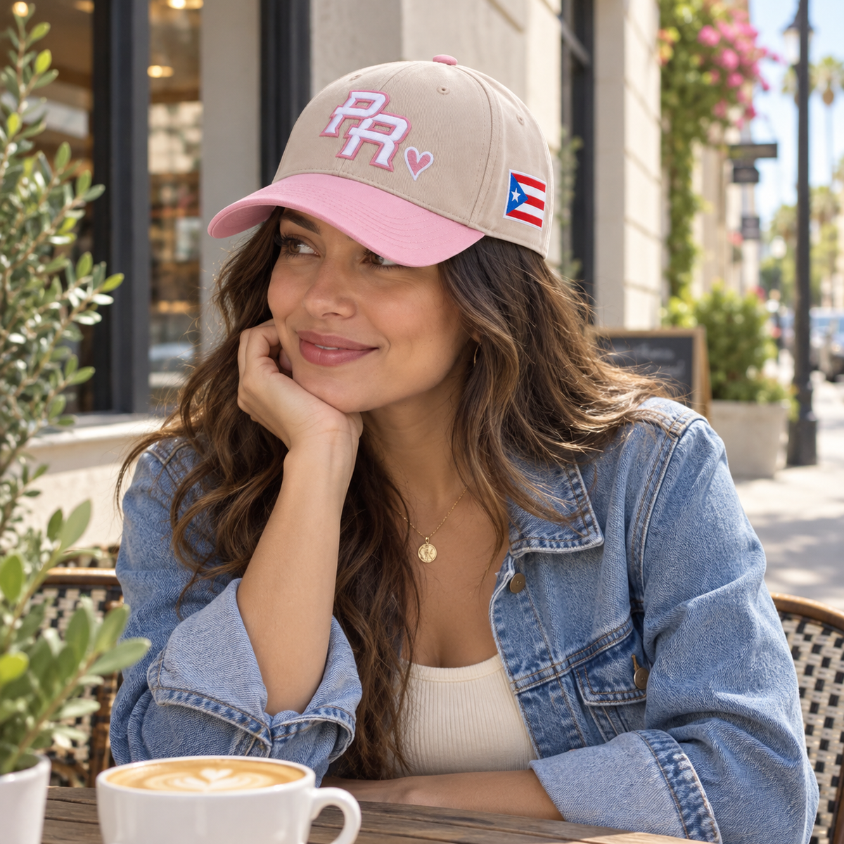 Blush Pink Puerto Rico PR cap styled at an outdoor cafe.
