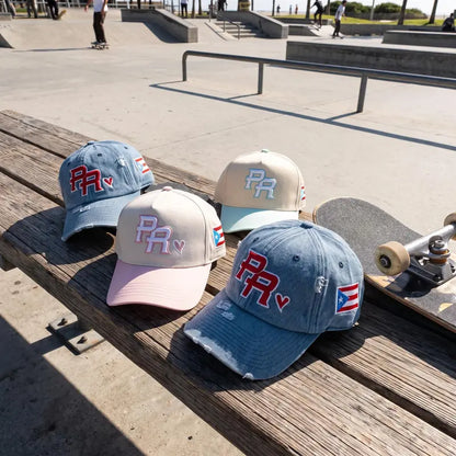 Puerto Rico PR cap colorways displayed together on a skatepark table.