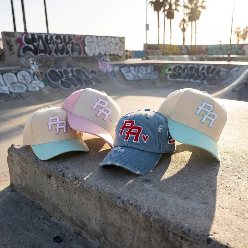 Blue Denim, Mint, and Blush Pink Puerto Rico PR caps at a skatepark.