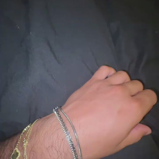 Creator showing the three chains in the Veyron bracelet set