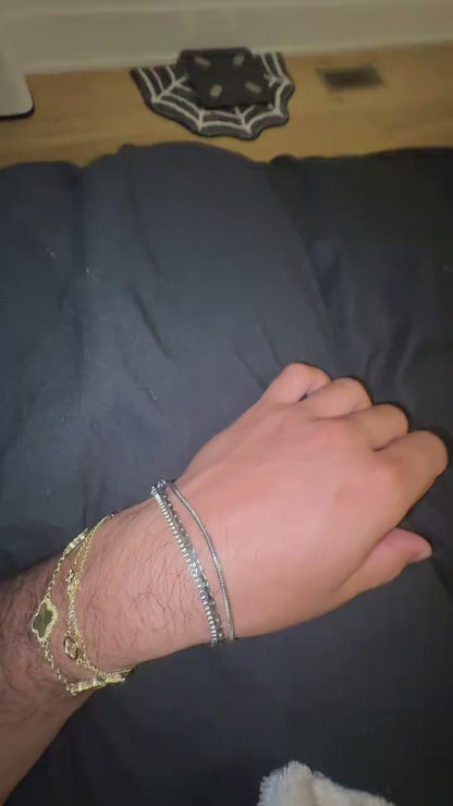 Creator showing the three chains in the Veyron bracelet set