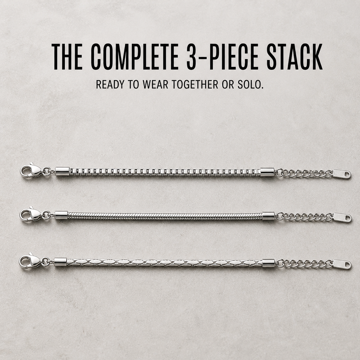 The complete three-piece Veyron bracelet stack arranged in parallel rows