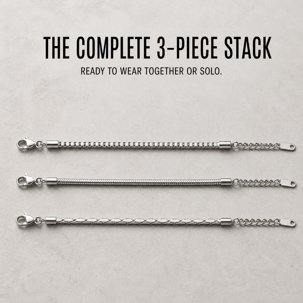 The complete three-piece Veyron bracelet stack arranged in parallel rows