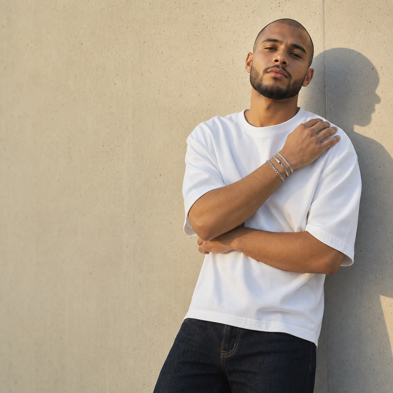 Man in a white tank wearing the Veyron three-piece bracelet stack