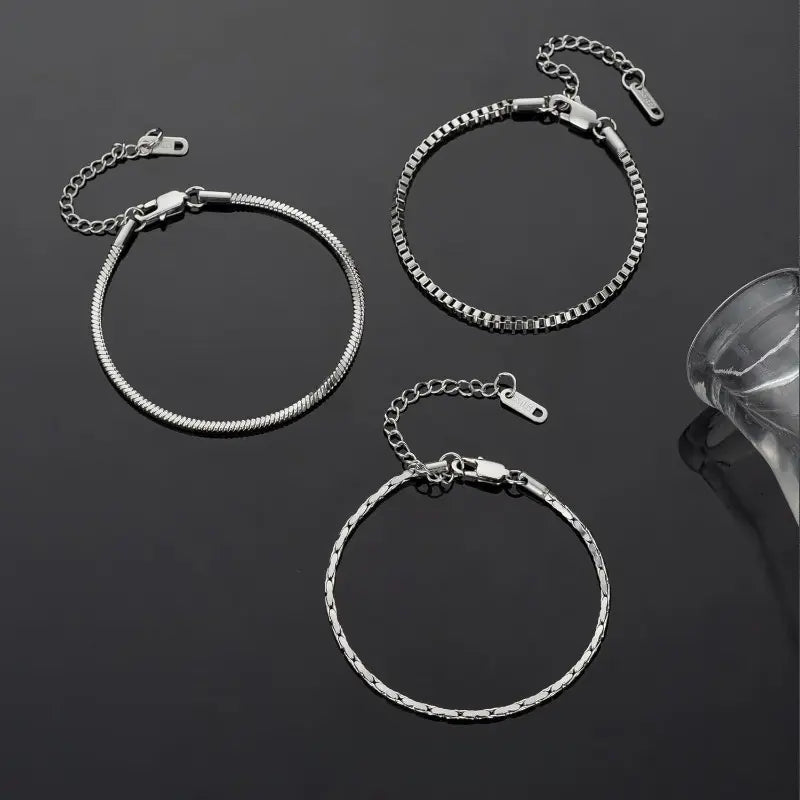 The three separate silver-tone bracelets included in the Veyron set